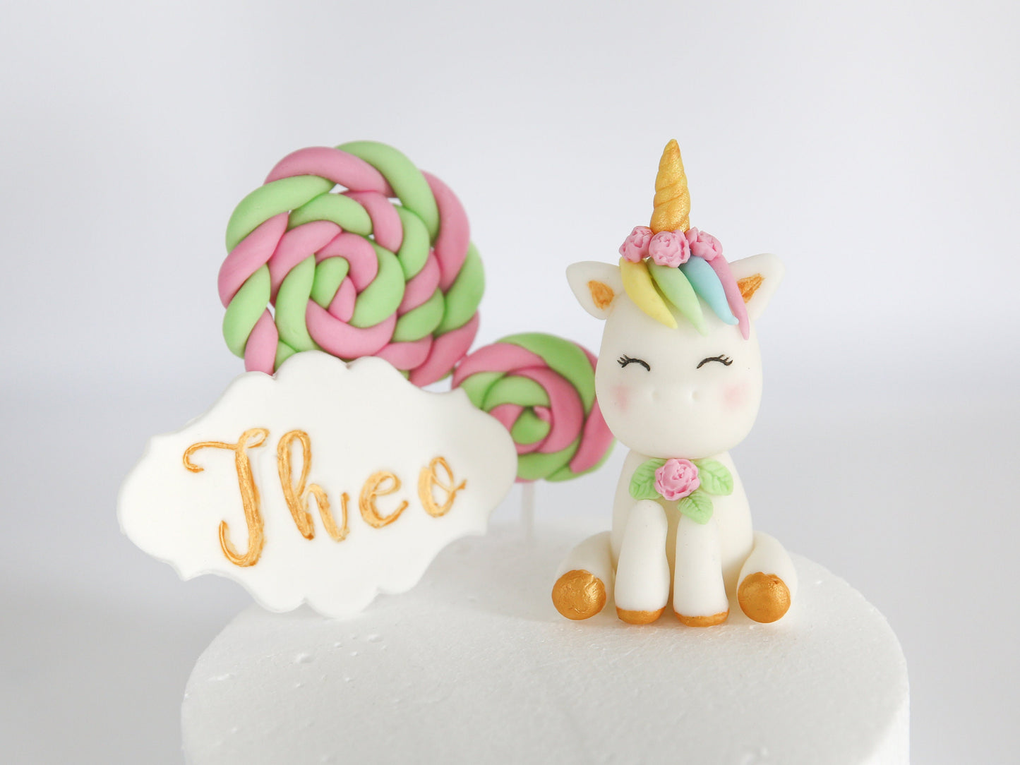 Cute Baby Unicorn Cake Topper Fondant in Cloud Bed and Smiling Unicorn with Lollipops and Name Tag